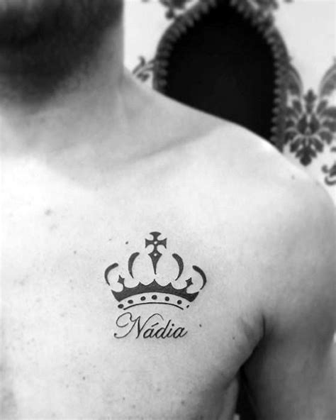 A Man With A Crown Tattoo On His Chest