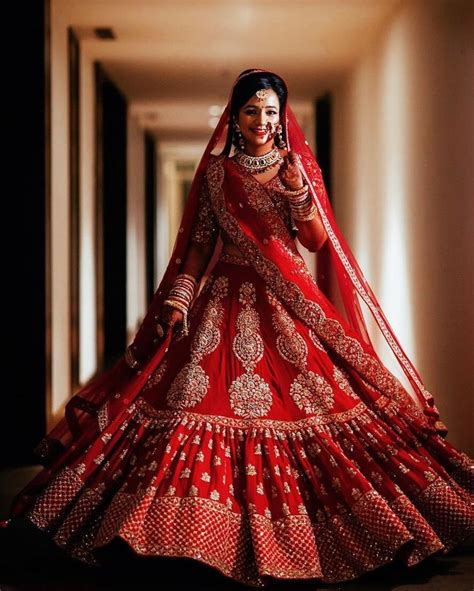 A Woman In A Red And White Bridal Gown