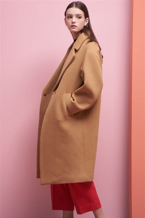 Camel hair long coat are designed from light but a dense material that acts as an insulation for the body. LOOKAST Oversized Long Wool Coat- Camel | Garmentory