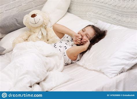 Cute Little Child Girl Wakes Up From Sleep Stock Photo Image Of