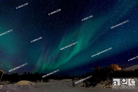 Aurora Borealis Commonly Known As The Northern Lights Viewed From The