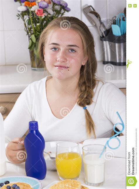 girl having breakfast in kitchen stock image image of food indoors 76799159