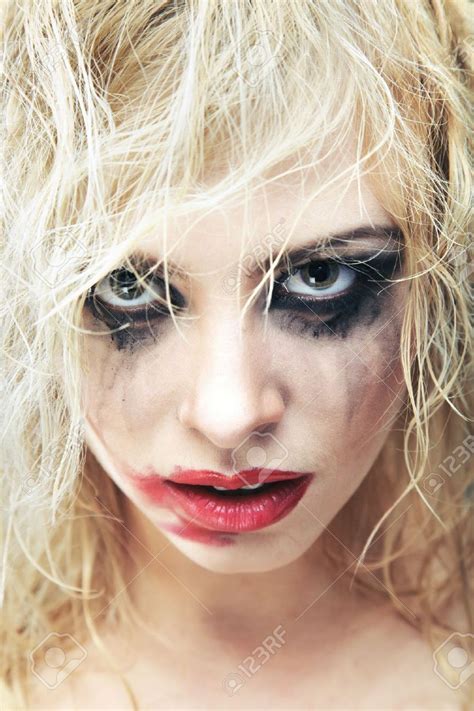 Blond Lady With Bizarre Makeup And Smeared Lipstick On Her Face