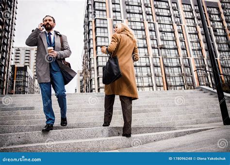 Serious Caucasian Businessman Going Down The Stairs Stock Photo Image