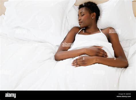Woman Resting In Bed Stock Photo Alamy