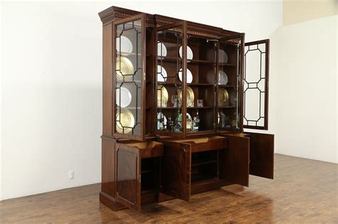 A bookcase or china cabinet with a center section projecting forward from the two end sections. SOLD - Traditional Mahogany Vintage Breakfront China ...