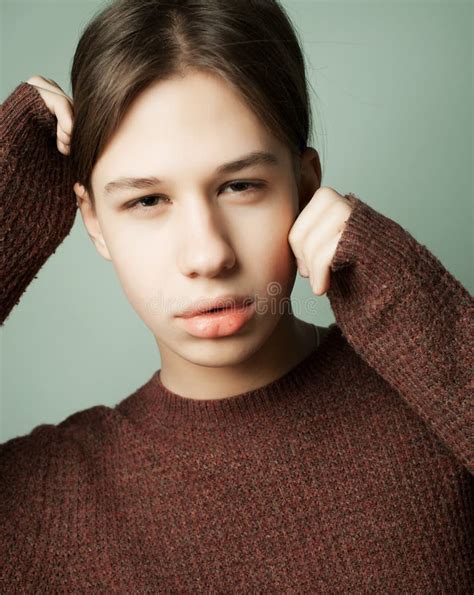 Attractive Teenage Boy Posing In Studio Over Grey Background Stock