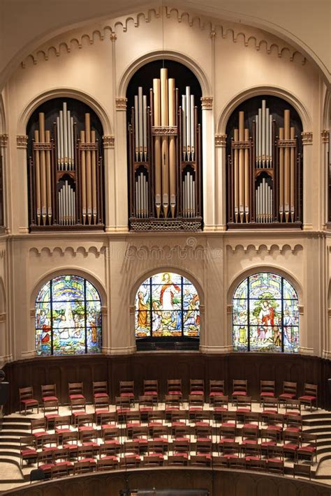 Choir Loft Stained Glass Windows And Organ Pipes In Church Sanctuary