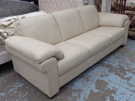 Back to article → how to clean red leather sofa. NATUZZI SOFA, three seater, cream leather, 230cm W x 92cm D.