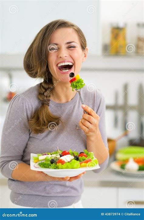 Young Woman Eating Greek Salad In Kitchen Stock Photo Image Of Meal