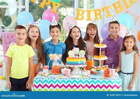 Happy Children At Birthday Party In Room Stock Photo Image Of