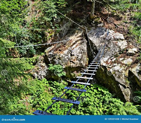 Adventure Via Ferrata Hiking Trail With A Rope Bridge Over A Gorge With
