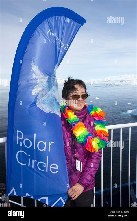 Passengers On An Antarctic Cruise Ship Celebrate Reaching The Polar