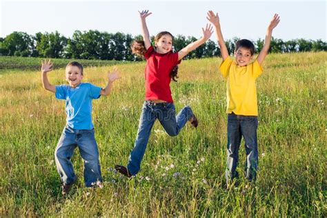 Group Of Happy Running Kids Stock Photo Image Of Meadow Group 32911046