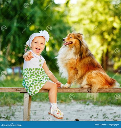Little Girl And Dog Sitting On A Bench Stock Image Image Of Breed