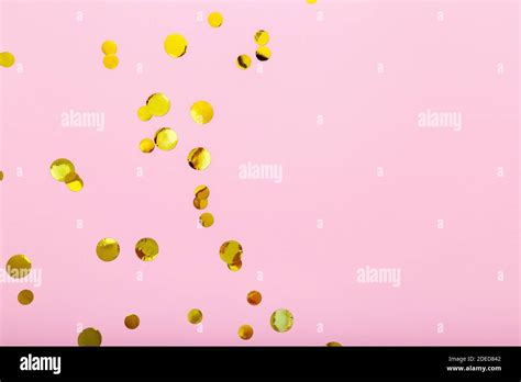 Gold Confetti Sparkles Frame On Pink Background Flat Lay Top View
