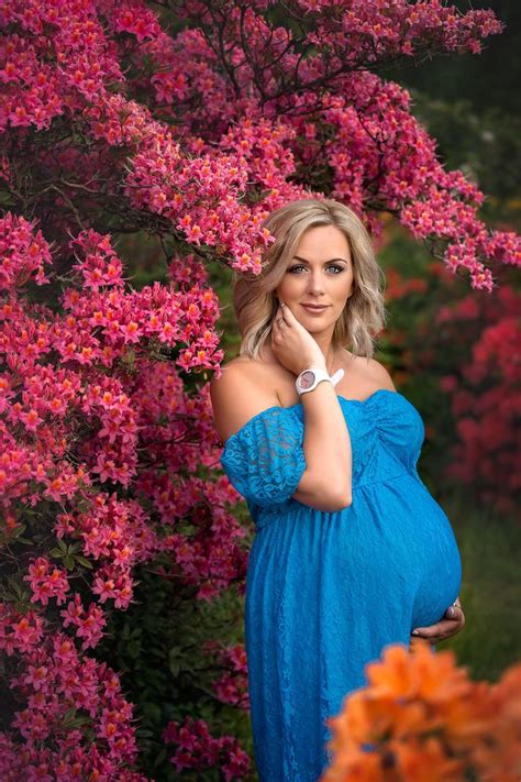 maternity shoot leeds beautiful blond pregnant woman in a long blue dress standandandnbs