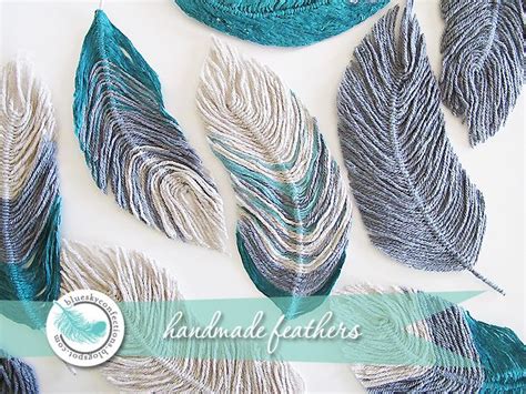 Several Different Types Of Feathers On A White Surface With Blue And
