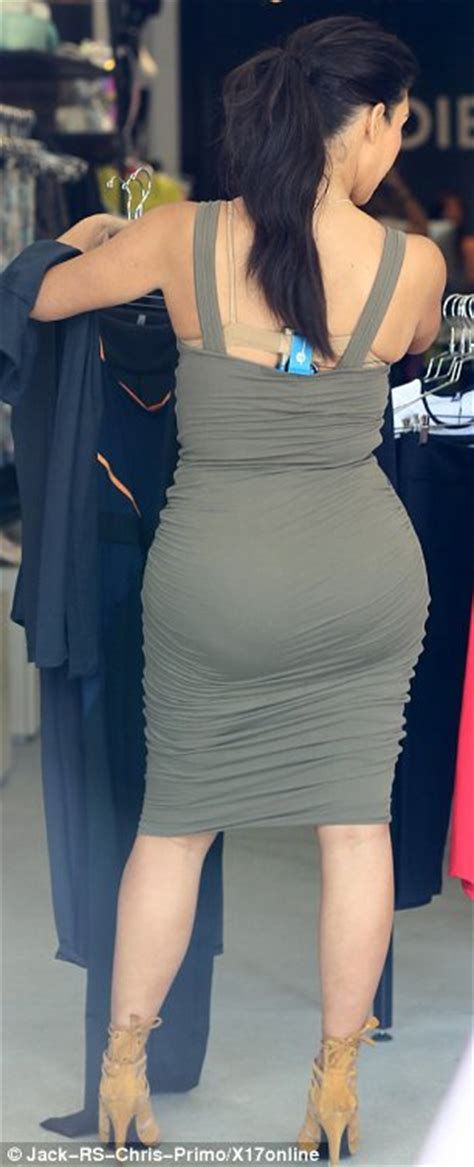 Kim Kardashian Displays Famous Derriere And Cleavage In Skintight Dress