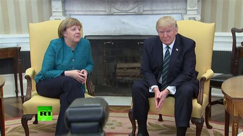 awkward moment trump ignores media prompts to shake hands with merkel youtube