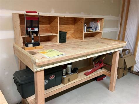 An Unfinished Workbench With Tools On It