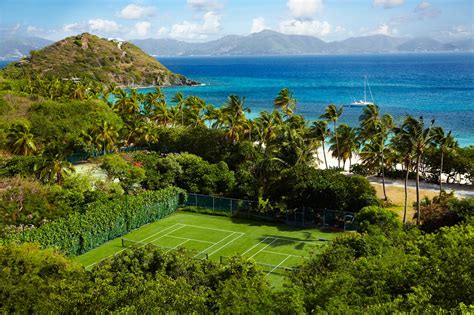 The court has a flat surface with marks on it tennis player equipment is as follows: 25 Gorgeous Oceanfront Tennis Courts