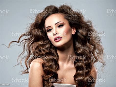 Face Of A Beautiful Woman With Long Brown Hair Stock Photo Download