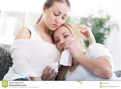 Friend Comforting Her Crying Friend At Home Royalty Free Stock Images