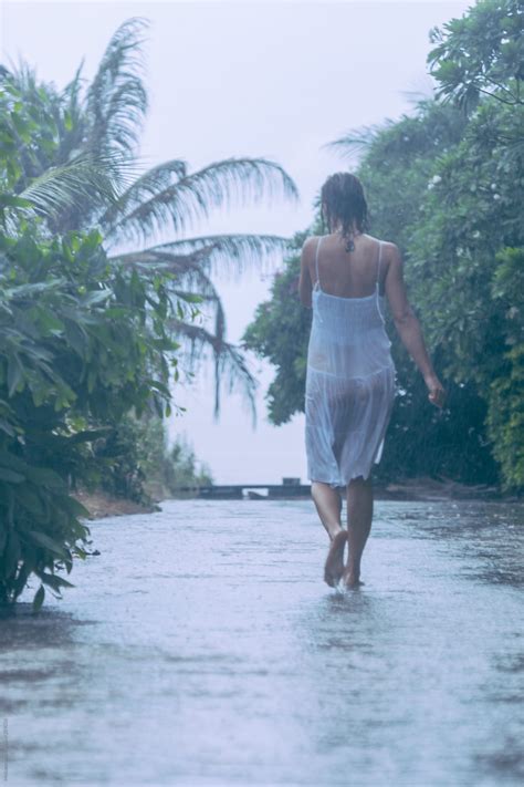 Woman Walking In The Heavy Rain By Stocksy Contributor Mosuno Stocksy