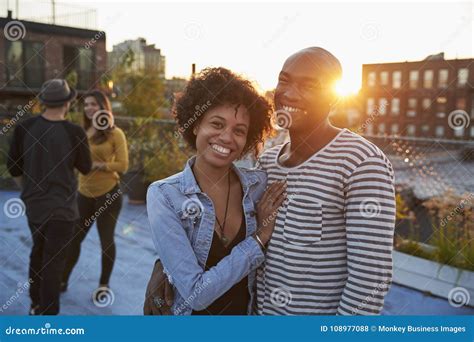 Young Black Couple Embracing At A Rooftop Party Stock Photo Image Of