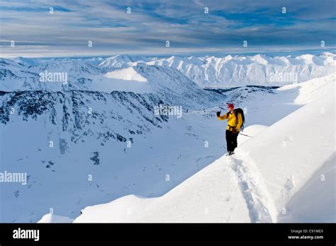 Skier Climbs High To Ski The Steep Southwest Face Of Kickstep Mountain
