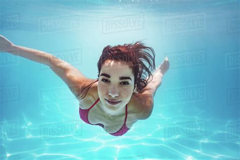 Beautiful Woman Swimming Underwater In Pool Female Swimmer In Bikini At Holiday Resort Stock