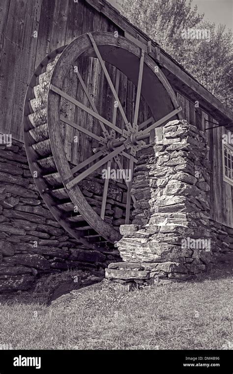 An Old Grist Mill With Water Wheel In Black And White Stock Photo Alamy