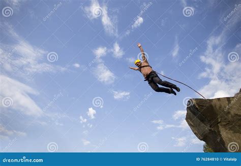 Jump Off A Cliff Stock Photo Image Of Jumpsuit People 76284810
