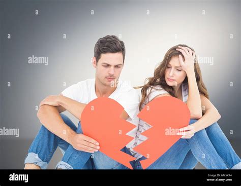 Sad Couple Holding Broken Hearts Stock Photo Alamy