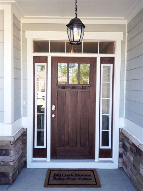 To paint a flat door, start by painting the inside hinge edge, working around the door in one direction. Go for a rich, dark wood for your front door to make a ...