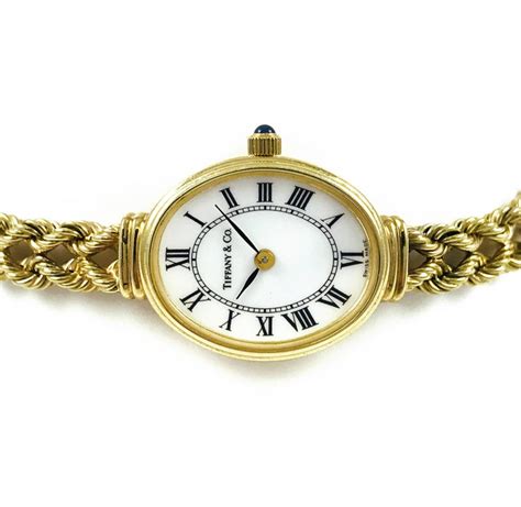 Follow us now on twitter and like us on facebook for spec. Tiffany and Co. Ladies Gold Bracelet Watch, Circa 1996 For Sale at 1stdibs
