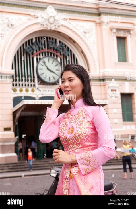 Ho Chi Minh City Vietnam Woman In Traditional Dress In Front Of The Main Post Office Stock
