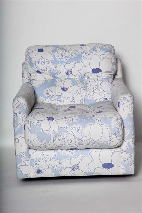 Take a seat in a flowering meadow, offered here in a timeless silhouette. Blue and White Floral Upholstered Armchair For Sale at 1stdibs
