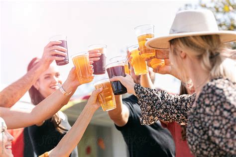 Beer Friends Raise A Toast By Stocksy Contributor Sean Locke Stocksy