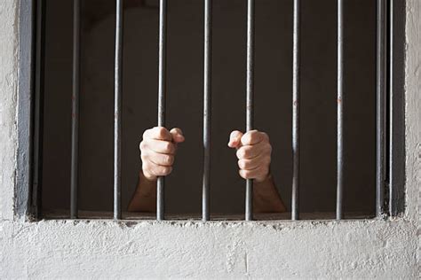 720 Hands On Prison Bars Stock Photos Pictures And Royalty Free Images