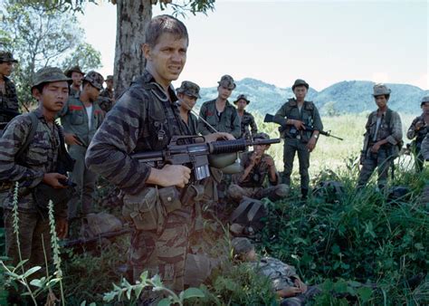 Us Army Special Forces Soldier On Patrol With An Arvn Unit In The