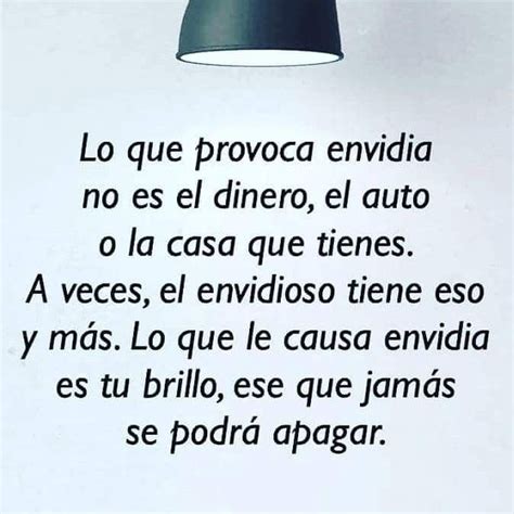 An Image Of A Poem Written In Spanish On A Piece Of Paper With A Lamp