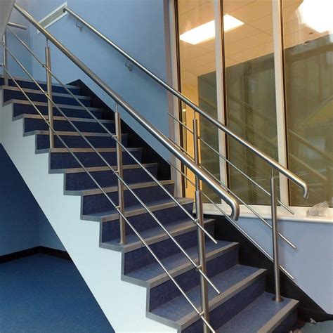 A table brings curved lines to a room with an interior metal stair railing. China SS304 Solid Rod Stainless Steel Railing Design for Balcony / Stairs - China Steel Railing ...