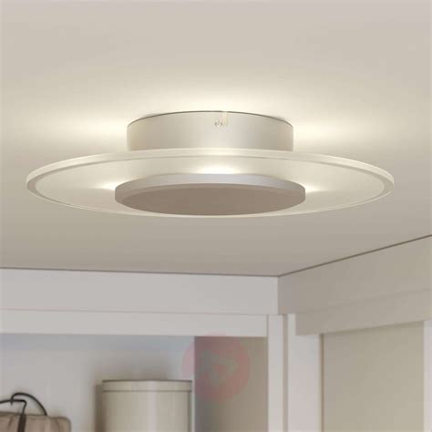 Finished with stylish bronze, it will look glamorous in your bedroom or a nursery room. Dora LED ceiling light, dimmable | Lights.co.uk