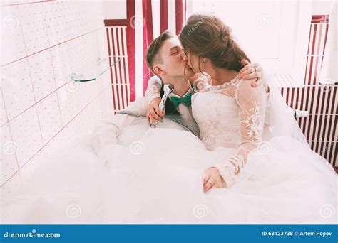 Kissing Bride And Groom Having Fun In Bathroom Stock Photo Image Of