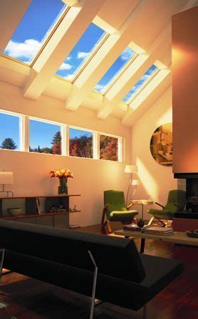 They allow for bright natural light. Living area with vaulted ceiling with exposed trusses and ...