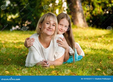 Mom Blonde With Daughter In The Park In Summer In Sunny Weather Stock Image Image Of Casual