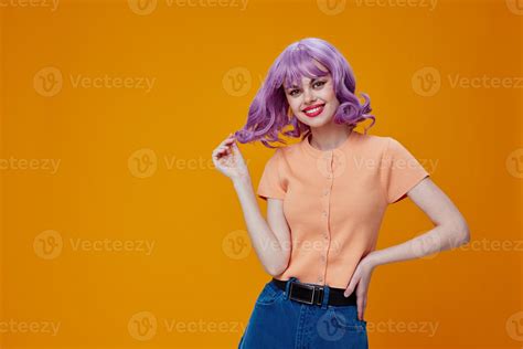 beautiful fashionable girl purple hair fashion posing glamor yellow background unaltered
