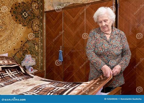 Senior Woman Makes The Bed Stock Photo Image Of Leisure 52640046
